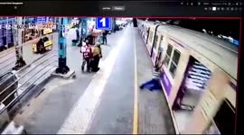 Station guards rescue man who falls under a moving train in Western India