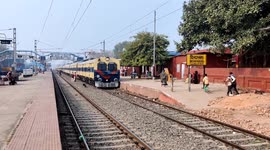 Some passengers who runing while attempting to board a moving train in Dildarnagar Railway junction, Uttar Pradesh