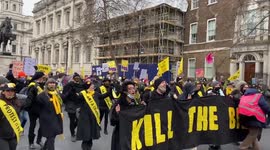 ‘Kill The Bill’ protesters holding hands march through Whitehall, London, UK