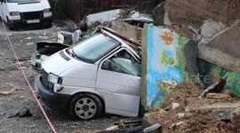 Heavy rain in West Bank causes wall to collapse crushing vehicles