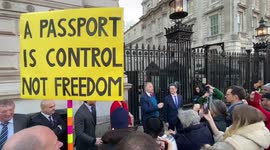Steve Baker chered bu anti-vaccine crowed outside Downing Street