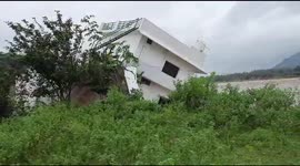 Swollen river engulfs a house in South India luckily residents evacuated earlier.