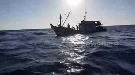 Thai navy rescues fishermen moments before their boat sinks at sea