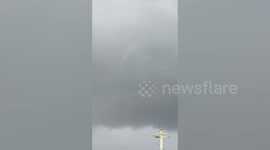 Powerful waterspout forms few metres away from shore terrifying residents