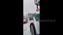 Cars stranded on Toronto, Canada roads amidst heavy snow