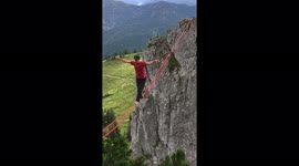 Daredevil edges across slackline above German mountains without any safety equipment