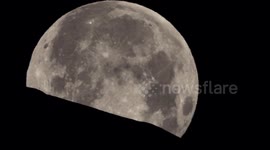 Photographer captures moment Wolf Moon sets behind mountain in the Swiss Alps
