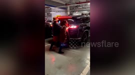 Women attempt to prevent vehicle from taking parking space in China