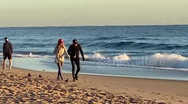 Beachgoers Pile on the Clothes for South Florida's First Cold Snap