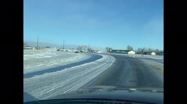 Taxi slides into the ditch icy roads and Highwinds with a passenger inside