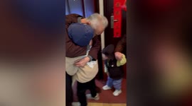 Elderly Chinese man hugs great grandsons after year without seeing them