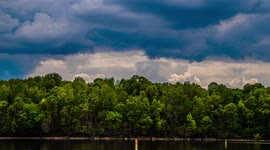 Storm Clouds Over Kentucky Timelapse With Fisherman On A Boat In Background