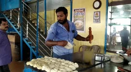 Satisfying footage shows chefs frisbeeing flatbreads across southern Indian restaurant