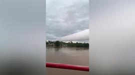 Rolling clouds merge into rare 'giant pipe' formation in Indonesia