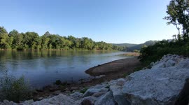 Beautiful Timelapse Of Current River In Missouri During The Early Hours Of A Summer Day As Fisherman Float Past