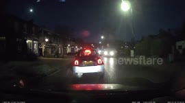 Car drives with frosted-up windscreen in London. Can they see where they are going?