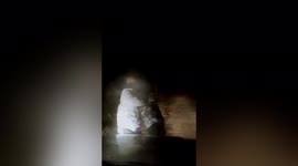 Boy runs in dark to meet parents coming back home for Chinese New Year
