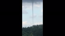Waterspout towers above Costámbar in the Dominican Republic