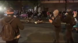 Seattle police officer filmed riding his bicycle over a protester's head