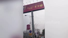 Bungling workers in China install huge billboard UPSIDE DOWN
