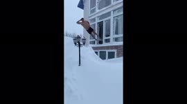 Young Russian men jump and swim in snowdrifts - hardy or foolhardy?
