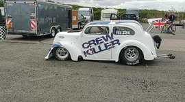 Ford Pop/Anglia and Ford Capri mk1 head for the drag strip at Santa Pod Raceway, Bedfordshire, England