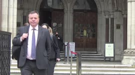 Arron Banks and Carole Cadwalladr leave Royal Courts of Justice during break in libel trial