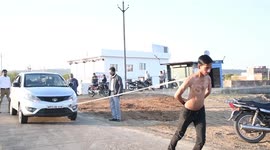 Indian man breaks record for pulling cars with just his shoulder blades