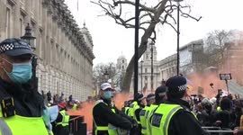 Smoke flares and scrubs thrown outside Downing Street for anti vaccine mandate protest