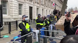 NHS workers against mandatory covid19 vaccines throw their scrubs over Downing Street