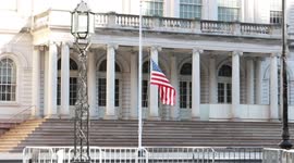 Flags fly at half-staff at New York City hall to honor fallen police officer