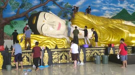 Buddha statue cleaned in preparation of Lunar New Year celebrations in Indonesia