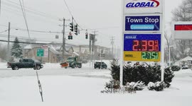Post road with traffic in Connecticut at winter storm 2021 near Global gas station