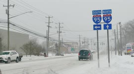 Post road with traffic in Connecticut at winter storm 2021 near entrance to I-95