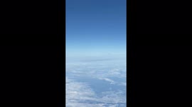 UFO spotted hovering in clouds during Ryanair flight from London to Budapest.