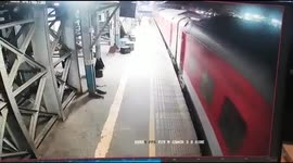 Incredible moment railway police official saves life of a man after he falls from a moving train in western India