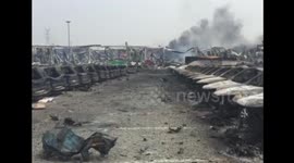 Debris at car parking lot near Tianjin explosion site