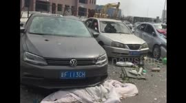 Cars in residential area damaged in Tianjin blast