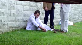'Drunk' college student struggles to put his sock on