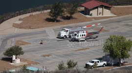Fire helicopter and tanker refueling at Castaic Lake parking lot V18959