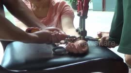Naughty child handcuffs his granny