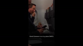 David Cameron enjoys crisps on Easyjet flight