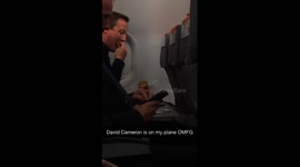 PM David Cameron enjoys crisps on Easyjet flight