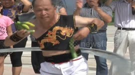 Man uses giant hula-hoop to slice cucumbers