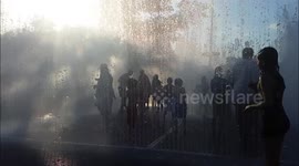 Tourists Enjoy Water Fountain Outside the Royal Festival Hall