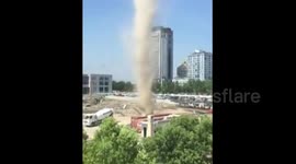 Huge dust devil at building site in China