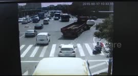 Two men on scooter survive being run over by truck