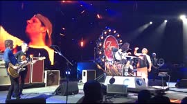 Dave Grohl shares beer onstage with man on his 50th