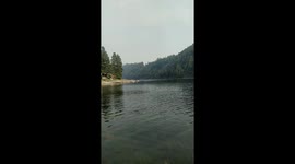 Airplane scooping water out of the upper lake