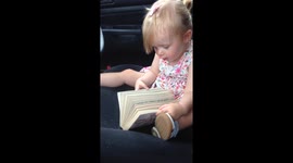One-year-old reading out loud